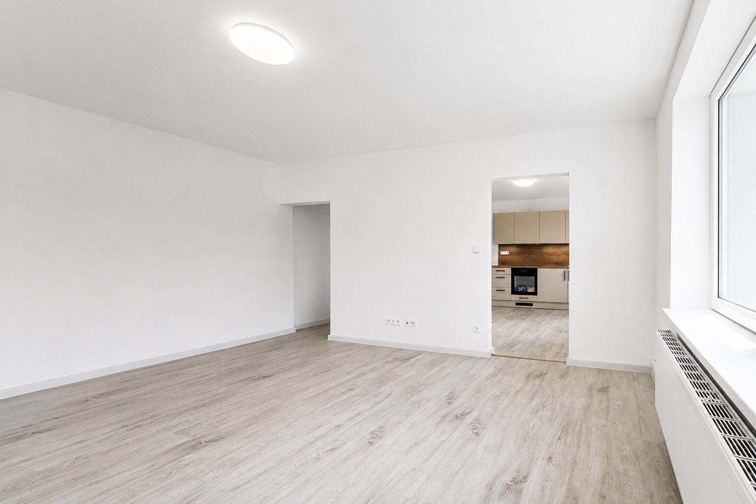 Rekonstrukce bytu 2+kk — obývací pokoj po rekonstrukci